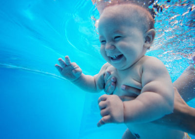 Baby,Background.,Happy,Infant,Learn,To,Swim,,Dive,Underwater,With